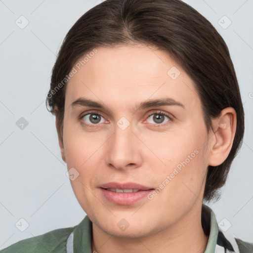 Joyful white young-adult female with medium  brown hair and grey eyes