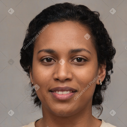 Joyful black young-adult female with medium  black hair and brown eyes