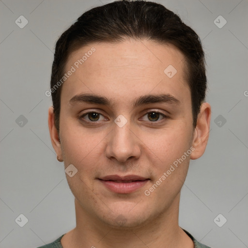 Joyful white young-adult male with short  brown hair and grey eyes