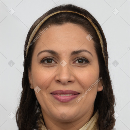 Joyful white adult female with long  brown hair and brown eyes