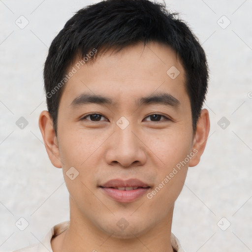 Joyful asian young-adult male with short  brown hair and brown eyes