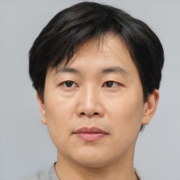 Neutral asian adult male with short  black hair and brown eyes