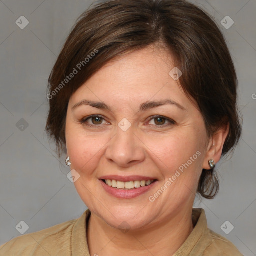 Joyful white adult female with medium  brown hair and grey eyes