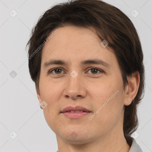 Joyful white adult female with medium  brown hair and brown eyes