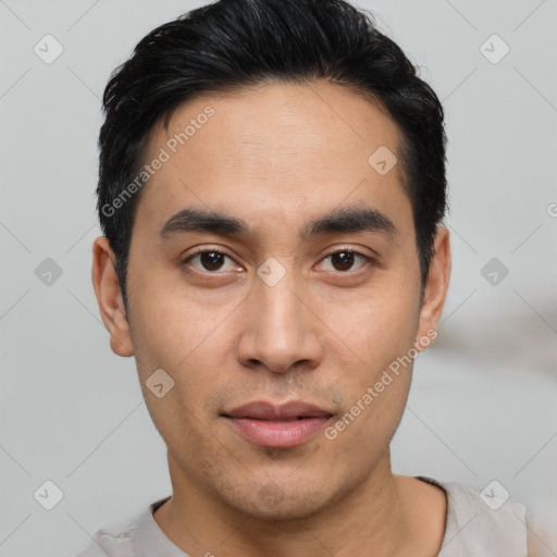 Joyful asian young-adult male with short  black hair and brown eyes