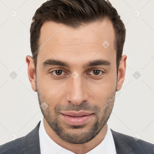 Joyful white young-adult male with short  brown hair and brown eyes