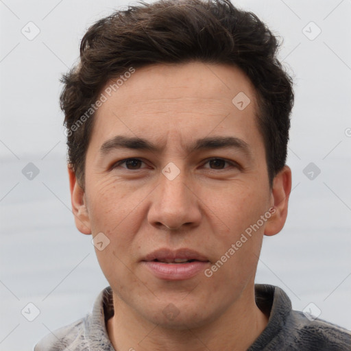 Joyful white adult male with short  brown hair and grey eyes