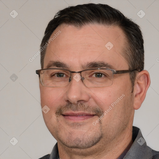 Joyful white adult male with short  brown hair and brown eyes