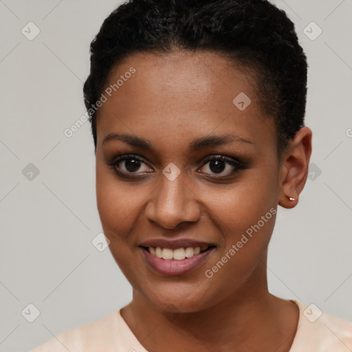 Joyful black young-adult female with short  black hair and brown eyes