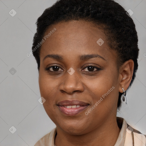 Joyful black young-adult female with short  brown hair and brown eyes