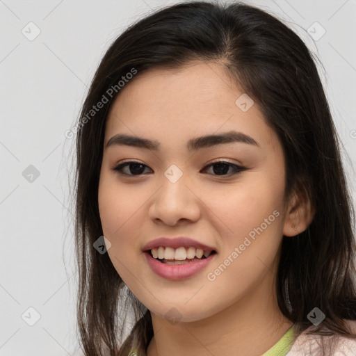 Joyful asian young-adult female with long  brown hair and brown eyes