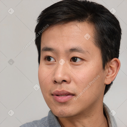 Neutral asian young-adult male with short  black hair and brown eyes