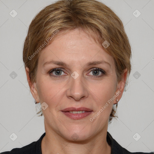 Joyful white adult female with medium  brown hair and grey eyes