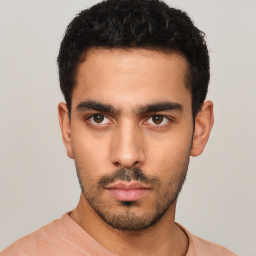 Neutral white young-adult male with short  black hair and brown eyes