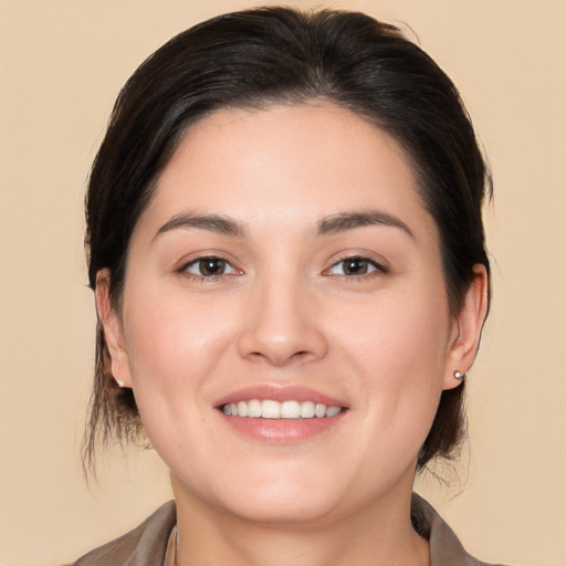 Joyful white young-adult female with medium  brown hair and brown eyes