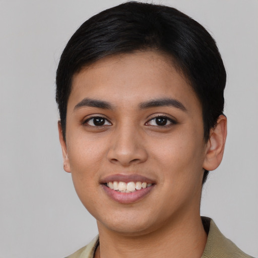 Joyful asian young-adult female with short  brown hair and brown eyes