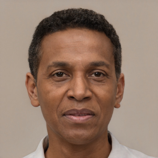 Joyful latino adult male with short  black hair and brown eyes