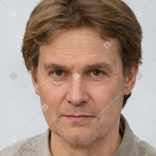 Joyful white adult male with short  brown hair and grey eyes