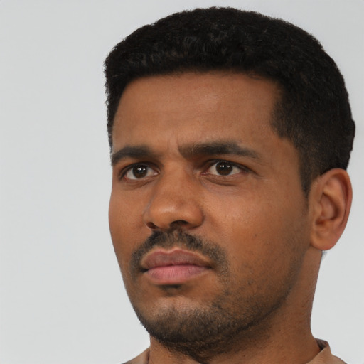 Neutral black young-adult male with short  black hair and brown eyes