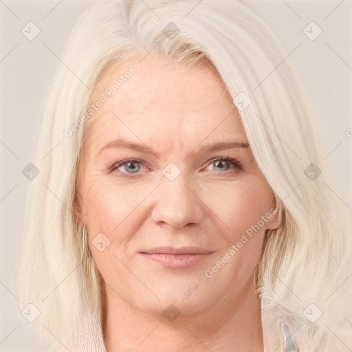 Joyful white adult female with medium  blond hair and blue eyes