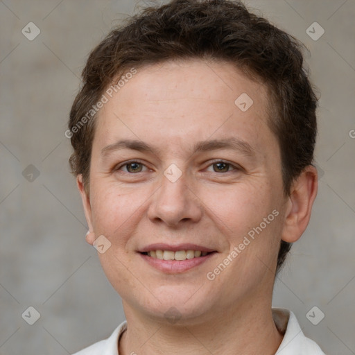 Joyful white adult female with short  brown hair and grey eyes