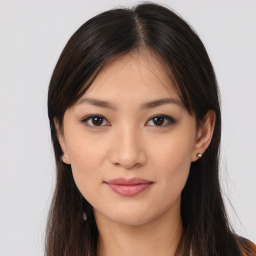 Joyful asian young-adult female with long  brown hair and brown eyes