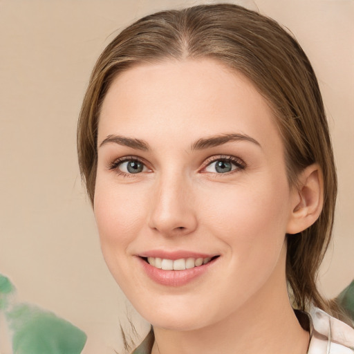 Joyful white young-adult female with medium  brown hair and green eyes