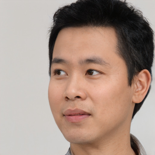 Neutral asian young-adult male with short  black hair and brown eyes