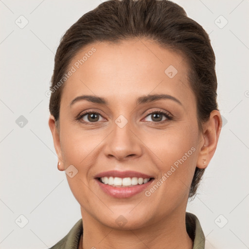 Joyful white young-adult female with short  brown hair and brown eyes