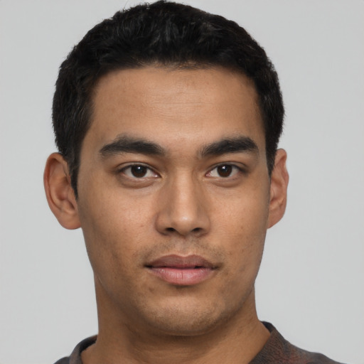 Neutral latino young-adult male with short  black hair and brown eyes