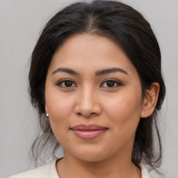 Joyful asian young-adult female with medium  brown hair and brown eyes