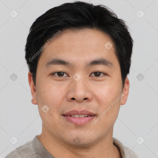 Joyful asian young-adult male with short  brown hair and brown eyes