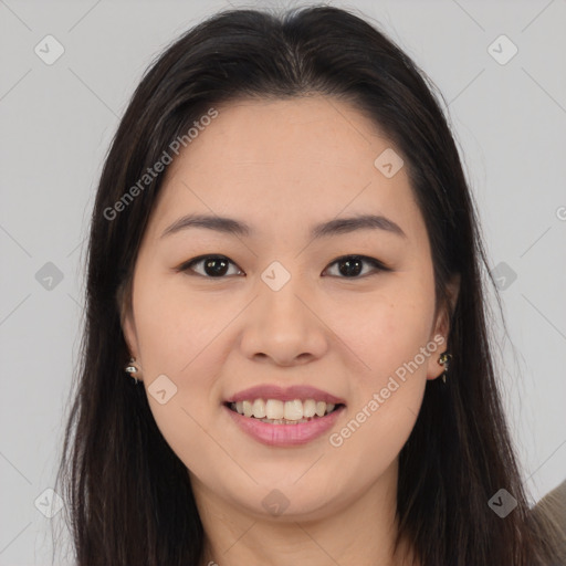 Joyful asian young-adult female with long  brown hair and brown eyes