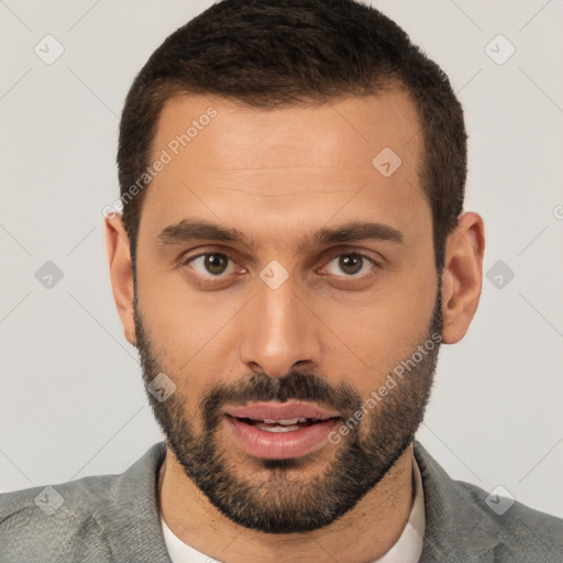 Joyful white young-adult male with short  brown hair and brown eyes