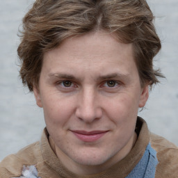 Joyful white adult female with medium  brown hair and blue eyes