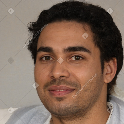 Joyful white adult male with short  black hair and brown eyes