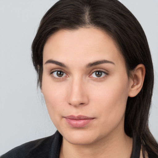 Neutral white young-adult female with long  brown hair and brown eyes