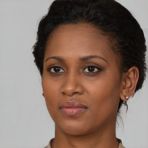 Neutral black young-adult female with medium  black hair and brown eyes