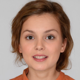 Joyful white child female with medium  brown hair and brown eyes