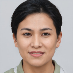 Joyful asian young-adult female with short  brown hair and brown eyes