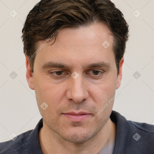 Joyful white adult male with short  brown hair and grey eyes