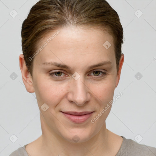 Joyful white young-adult female with short  brown hair and grey eyes