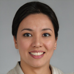 Joyful asian young-adult female with medium  brown hair and brown eyes