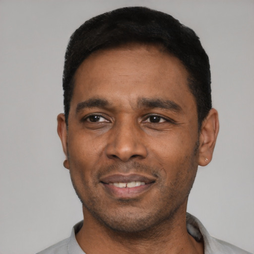 Neutral latino adult male with short  black hair and brown eyes