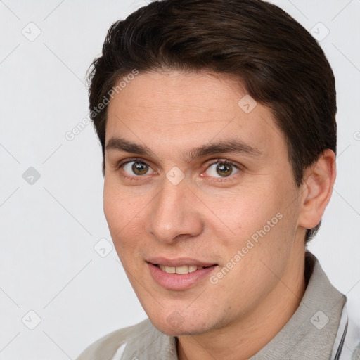 Joyful white adult male with short  brown hair and brown eyes