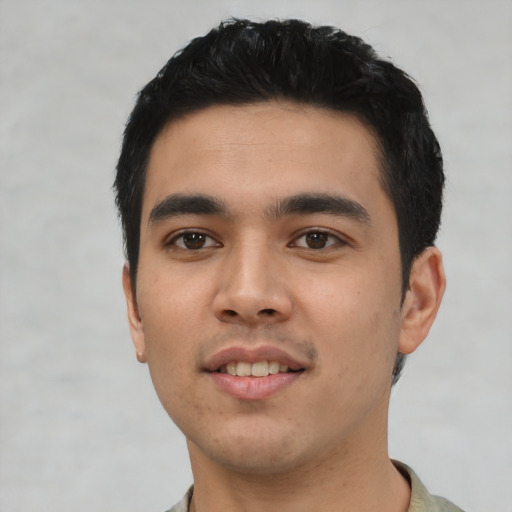 Joyful asian young-adult male with short  black hair and brown eyes