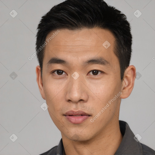 Neutral asian young-adult male with short  black hair and brown eyes