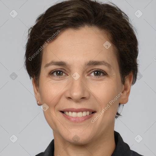 Joyful white adult female with short  brown hair and brown eyes