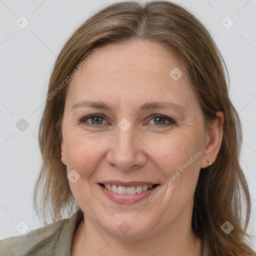 Joyful white adult female with medium  brown hair and grey eyes