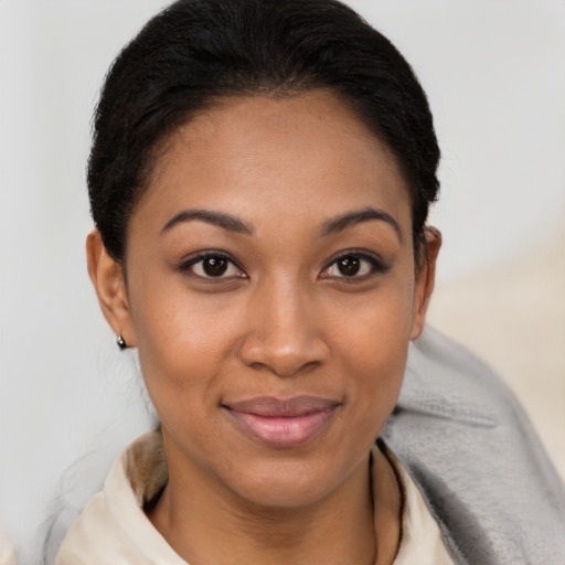 Joyful latino young-adult female with short  brown hair and brown eyes